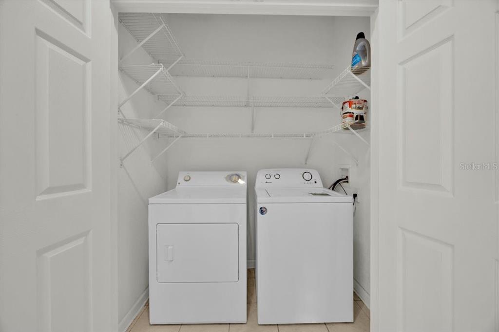 13524 Turtle Marsh Loop, Unit 621 Orlando, FL 32837 - Photo 20 of 26 a utility room with dryer and washer