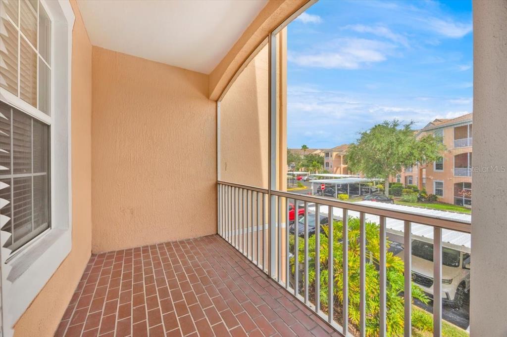 13524 Turtle Marsh Loop, Unit 621 Orlando, FL 32837 - Photo 22 of 26 a view of a balcony with wooden floor