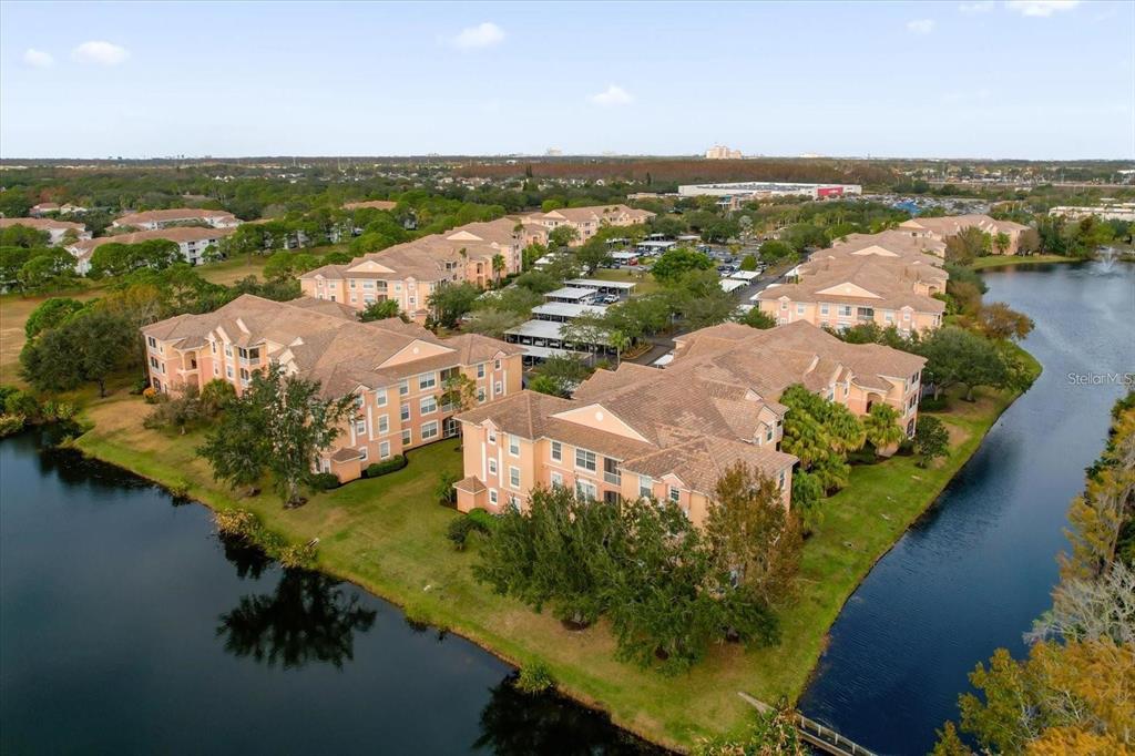 13524 Turtle Marsh Loop, Unit 621 Orlando, FL 32837 - Photo 23 of 26 an aerial view of lake residential house with outdoor space