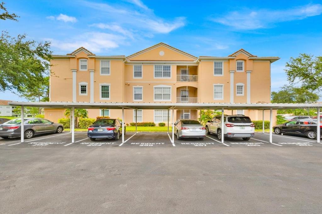 13524 Turtle Marsh Loop, Unit 621 Orlando, FL 32837 - Photo 24 of 26 a view of a car park in front of house