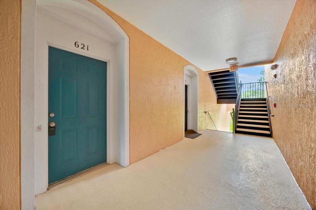 13524 Turtle Marsh Loop, Unit 621 Orlando, FL 32837 - Photo 25 of 26 a view of a room with stairs and a yard