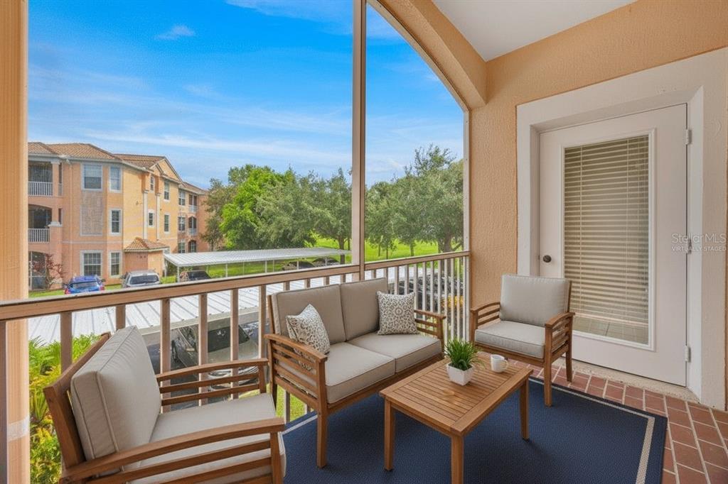 13524 Turtle Marsh Loop, Unit 621 Orlando, FL 32837 - Photo 3 of 26 a view of a balcony with chairs