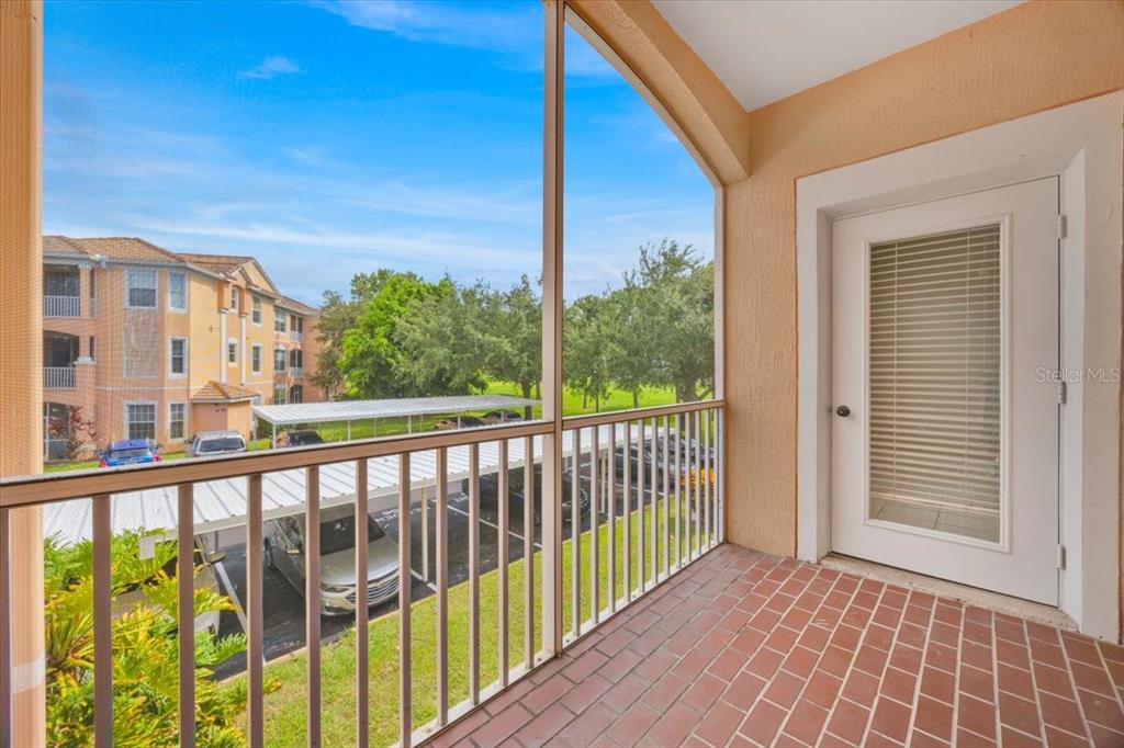 13524 Turtle Marsh Loop, Unit 621 Orlando, FL 32837 - Photo 4 of 26 a view of a balcony with wooden floor