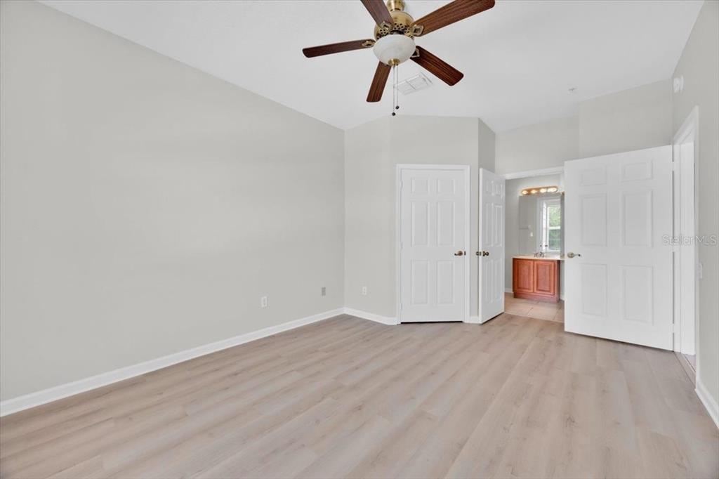 13524 Turtle Marsh Loop, Unit 621 Orlando, FL 32837 - Photo 8 of 26 wooden floor in an empty room