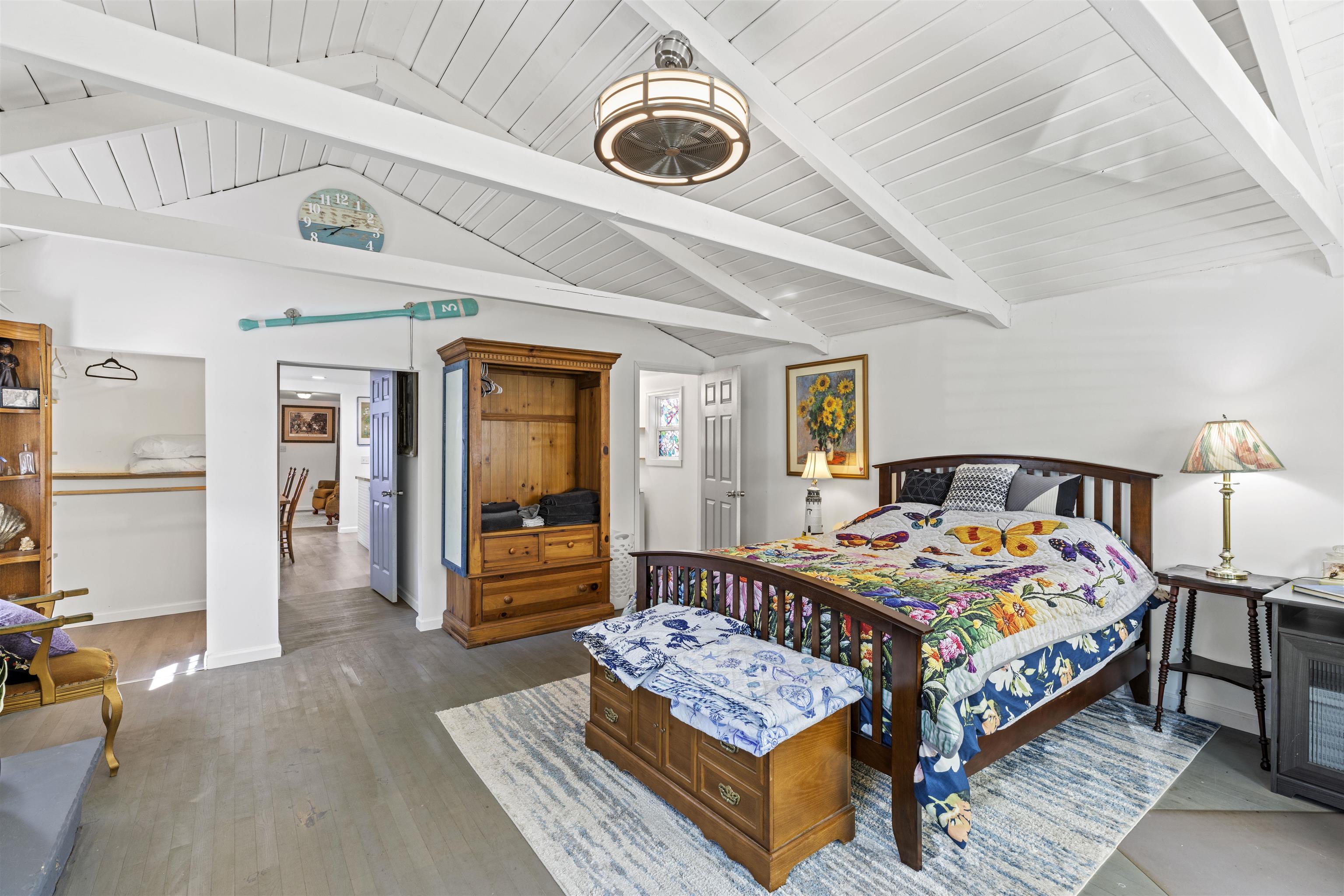35 Bay Shore Road Cape May, NJ 08204 - Photo 12 of 45 a bedroom with a bed and wooden floor