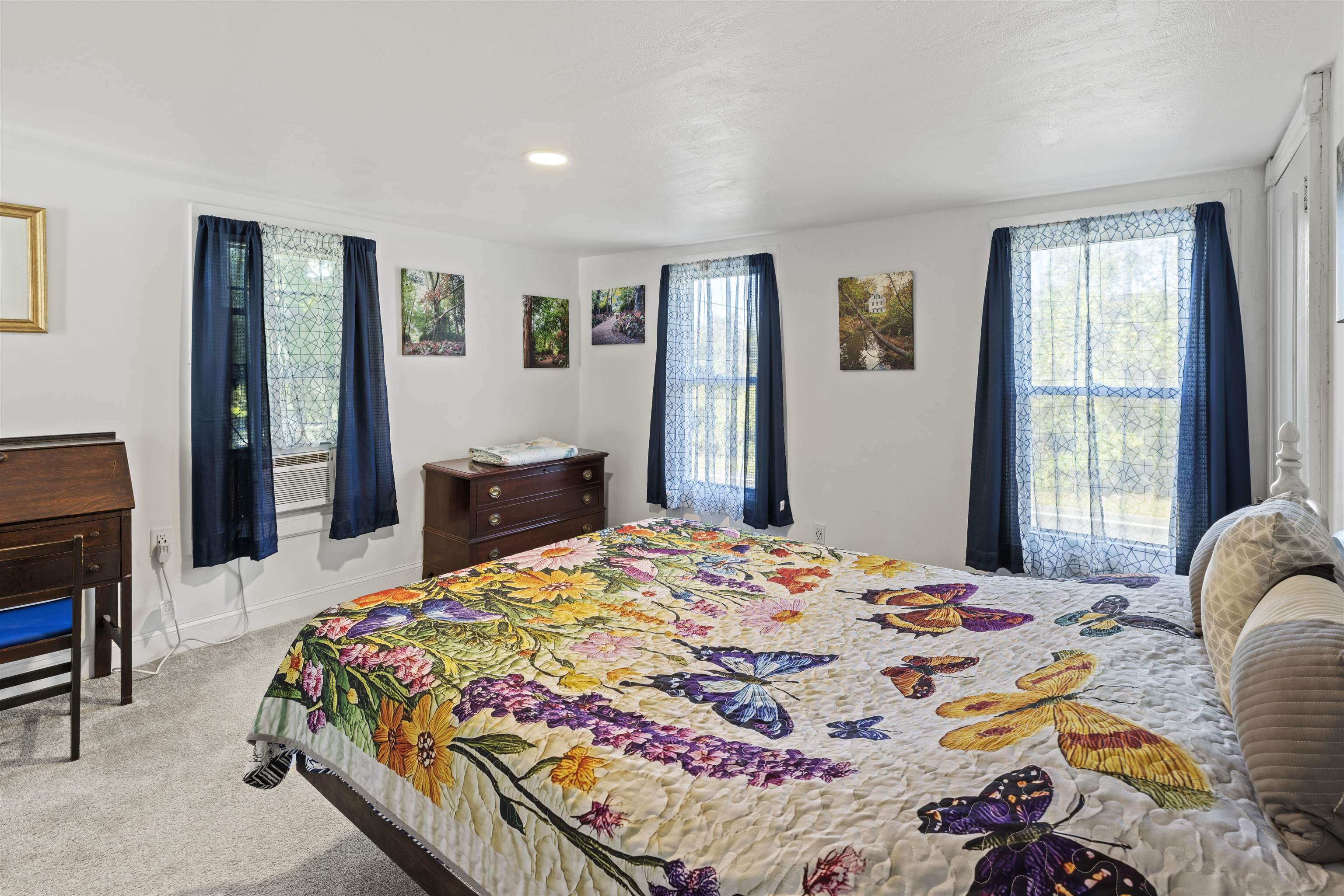 35 Bay Shore Road Cape May, NJ 08204 - Photo 16 of 45 a bedroom with a bed and wooden floor