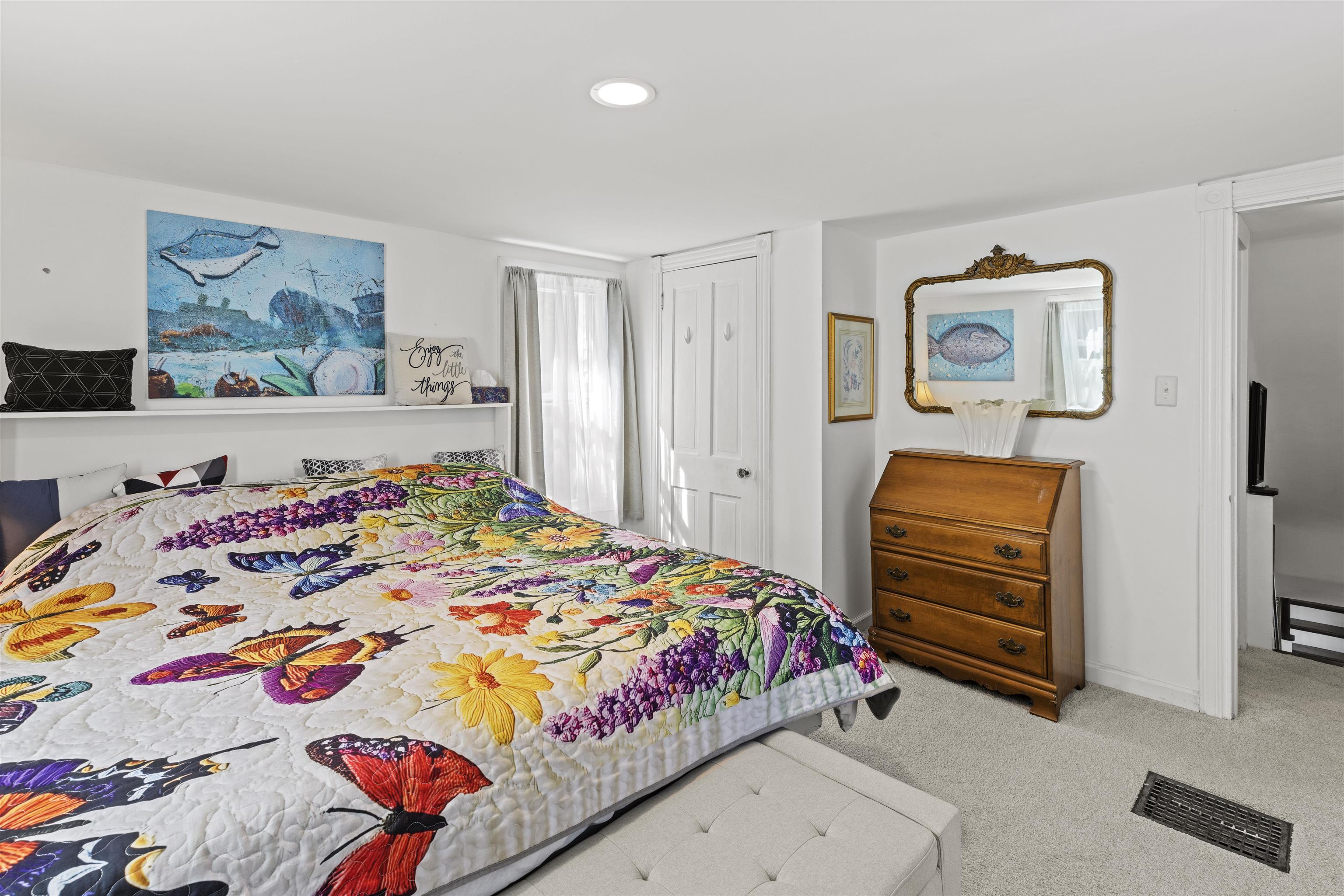 35 Bay Shore Road Cape May, NJ 08204 - Photo 23 of 45 a bedroom with a bed and a painting on the wall