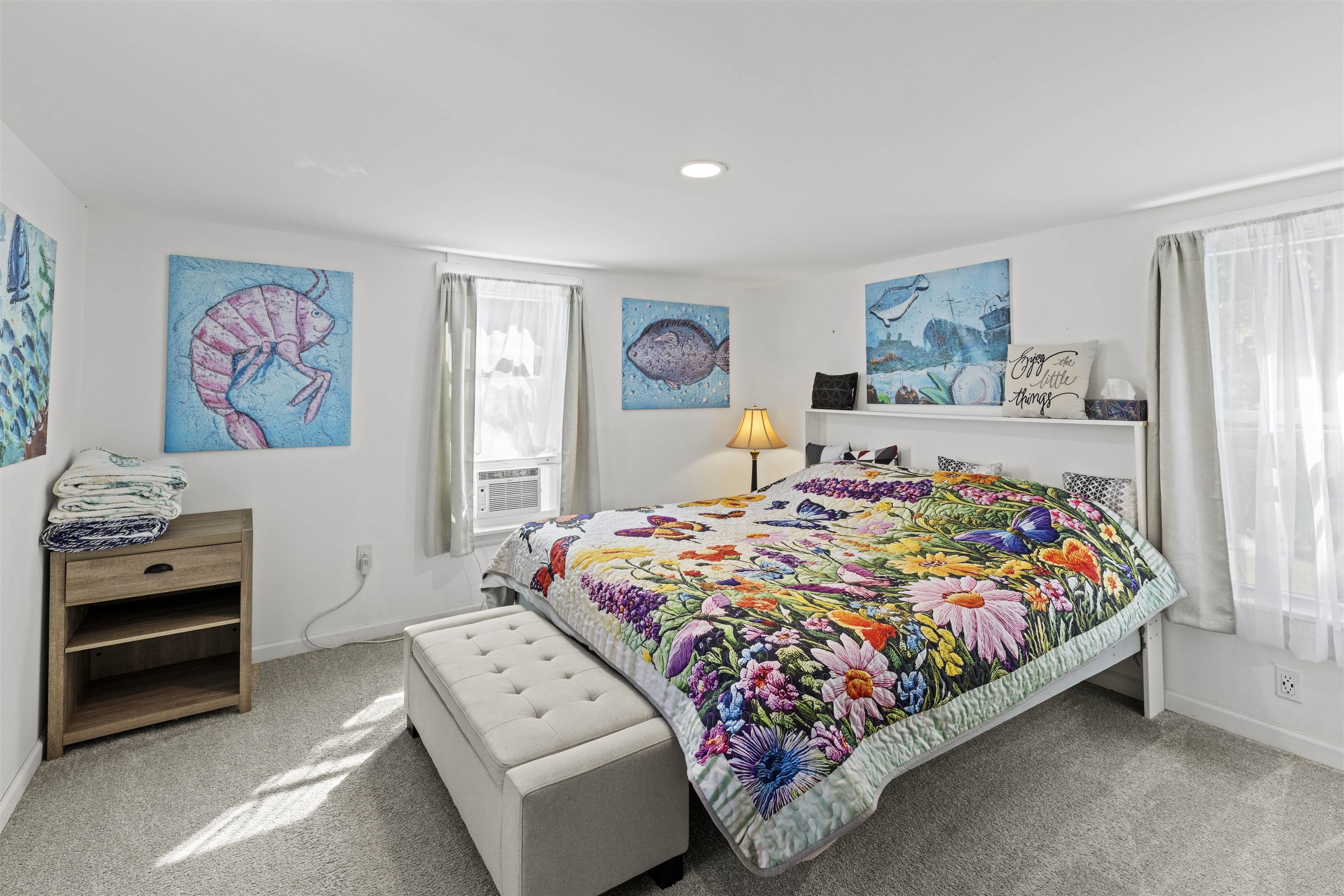 35 Bay Shore Road Cape May, NJ 08204 - Photo 25 of 45 a bedroom with a bed and a chandelier