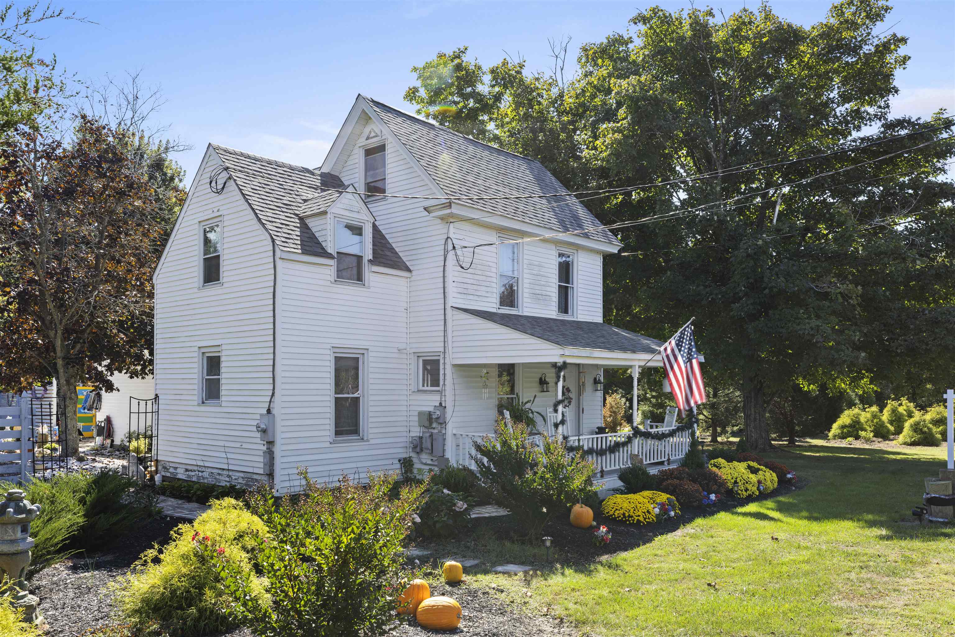 35 Bay Shore Road Cape May, NJ 08204 - Photo 3 of 45 a front view of a house with a yard and fountain