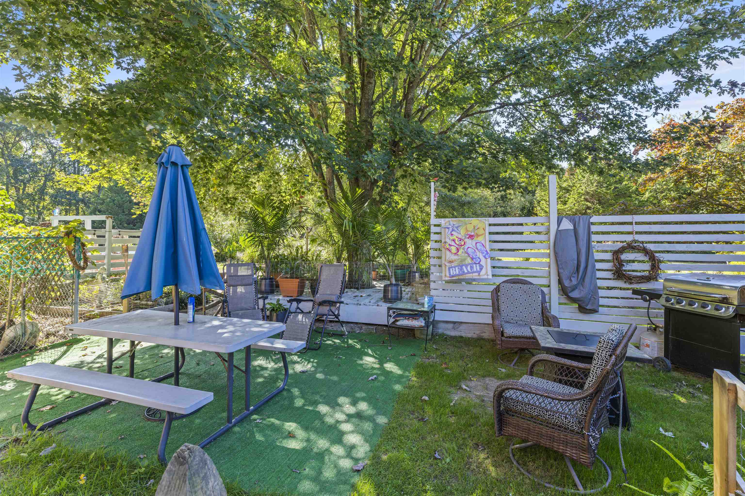 35 Bay Shore Road Cape May, NJ 08204 - Photo 36 of 45 a view of a backyard with couches table and chairs