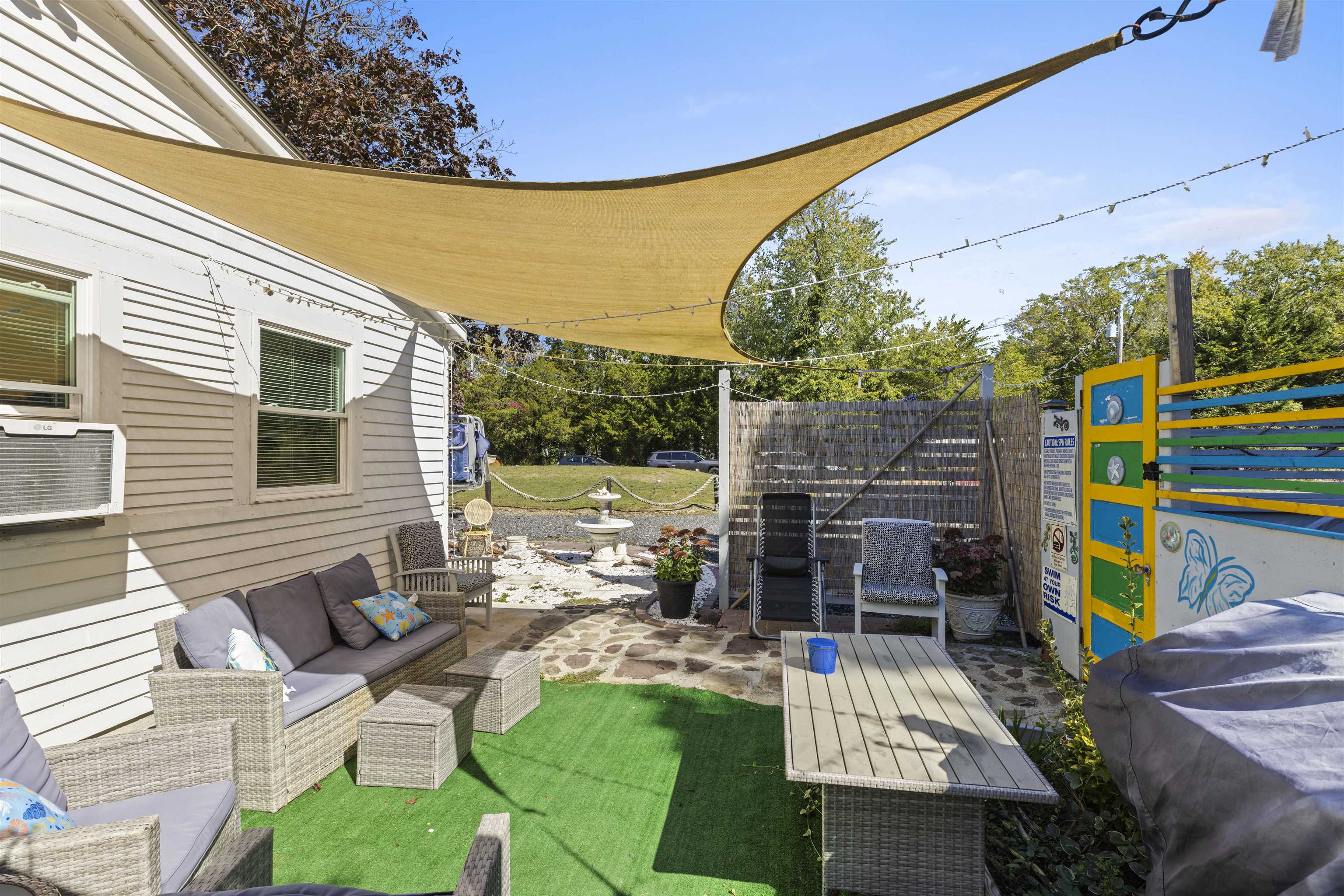 35 Bay Shore Road Cape May, NJ 08204 - Photo 37 of 45 a view of a patio with a table chairs and a backyard