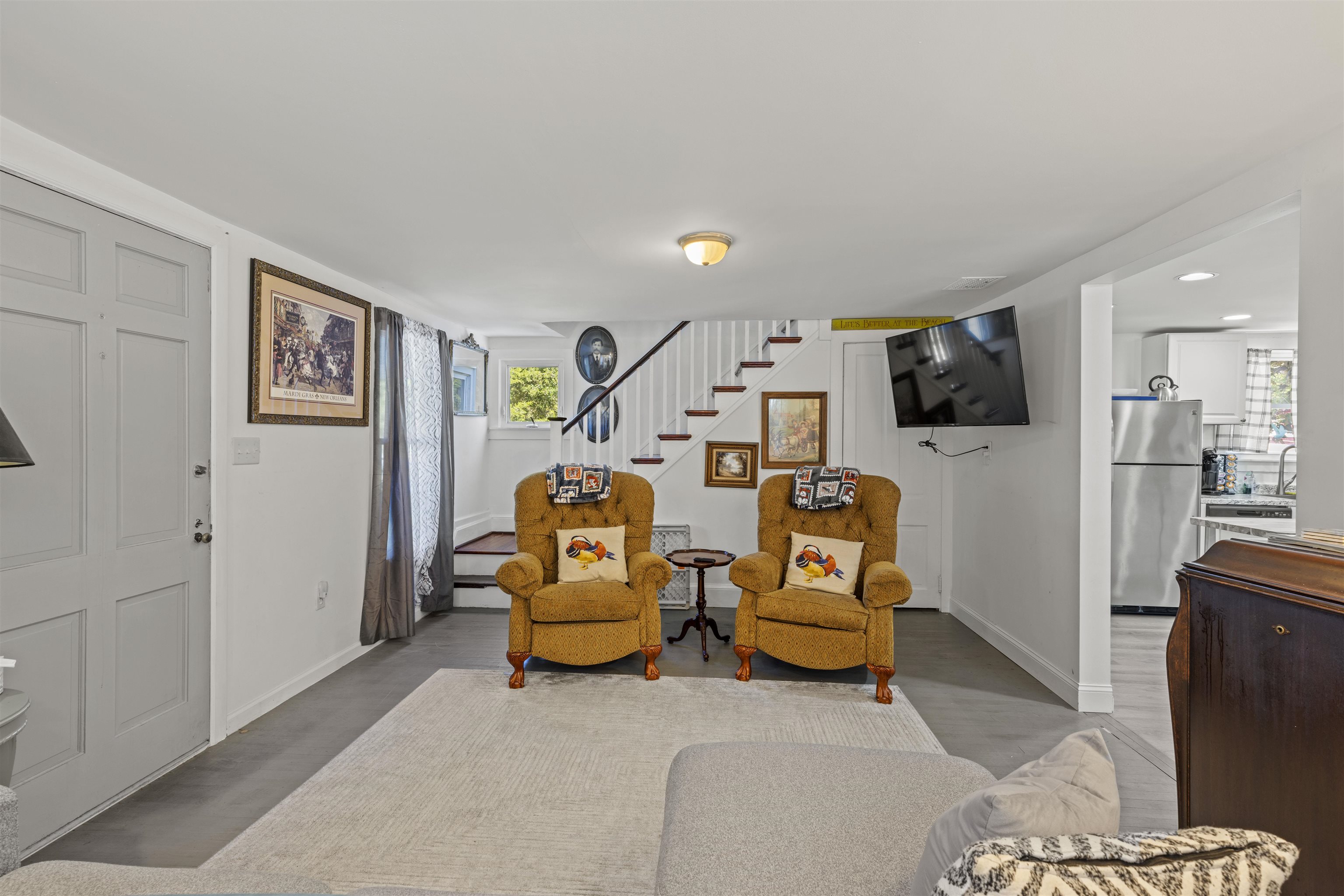 35 Bay Shore Road Cape May, NJ 08204 - Photo 10 of 45 a living room with furniture and a flat screen tv