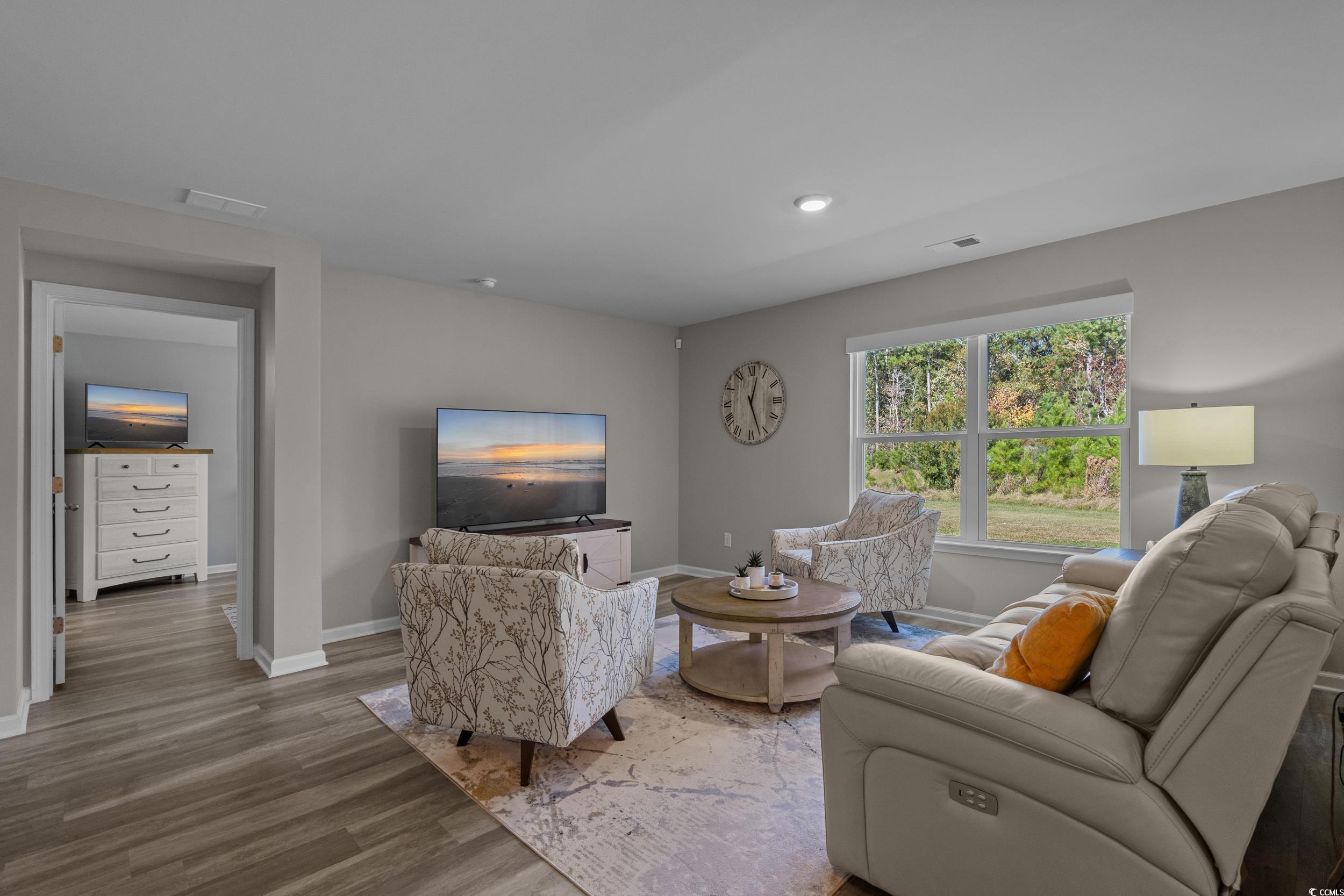 1803 Promise Pl. Myrtle Beach, SC 29588 - Photo 15 of 40 Living area with wood finished floors and recessed lighting