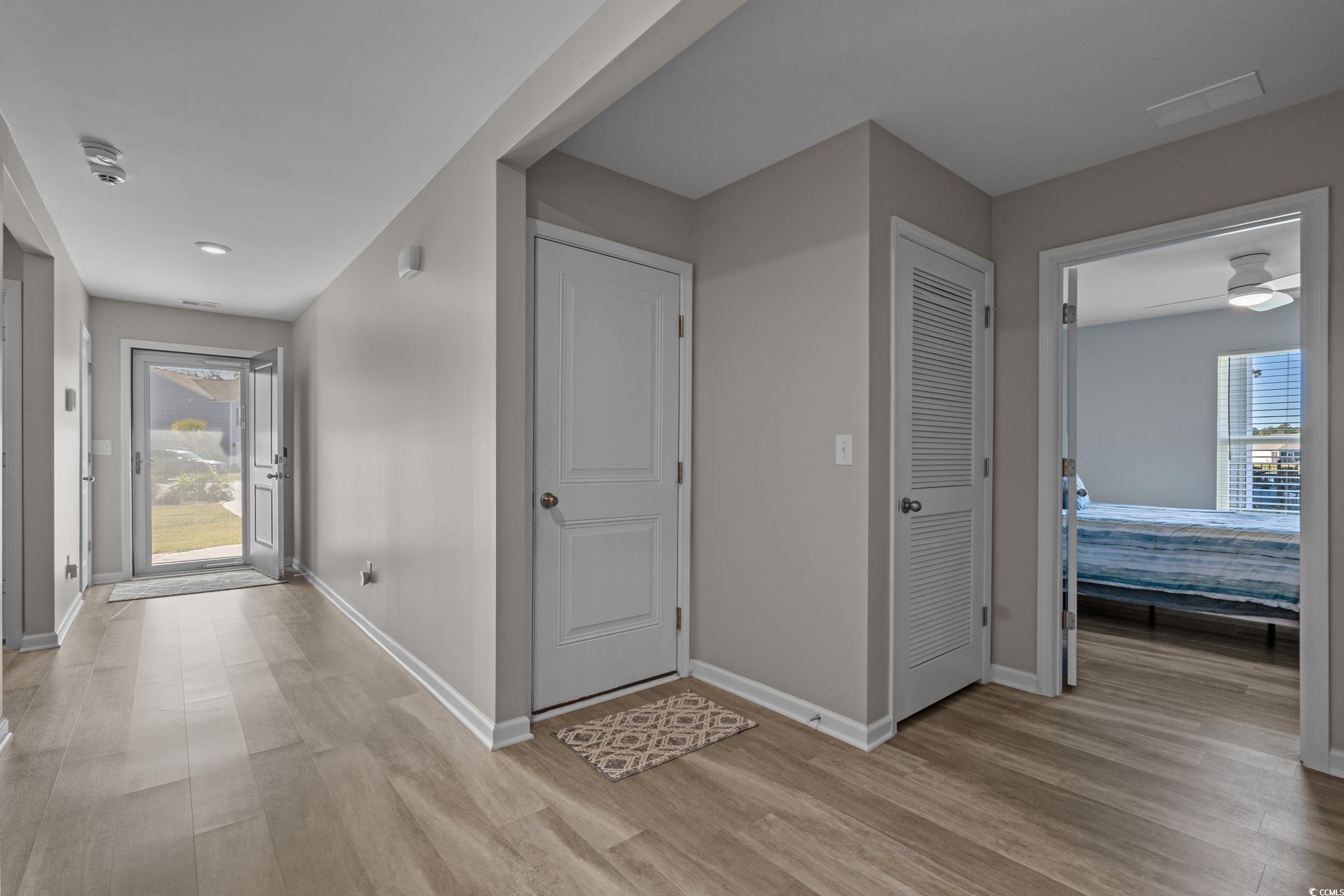 1803 Promise Pl. Myrtle Beach, SC 29588 - Photo 21 of 40 Hall with plenty of natural light and light wood-type flooring