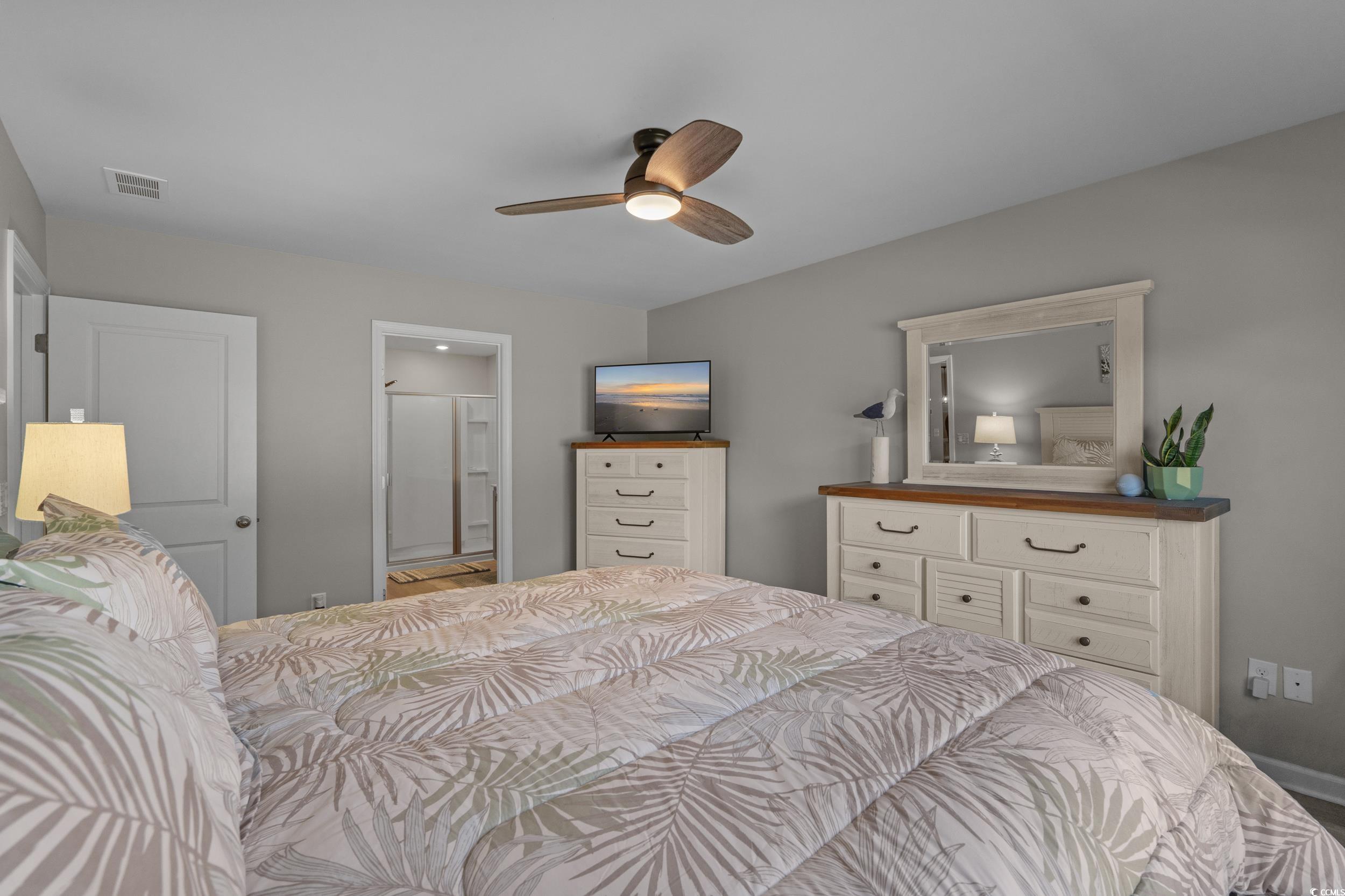 1803 Promise Pl. Myrtle Beach, SC 29588 - Photo 23 of 40 Bedroom with a ceiling fan and connected bathroom