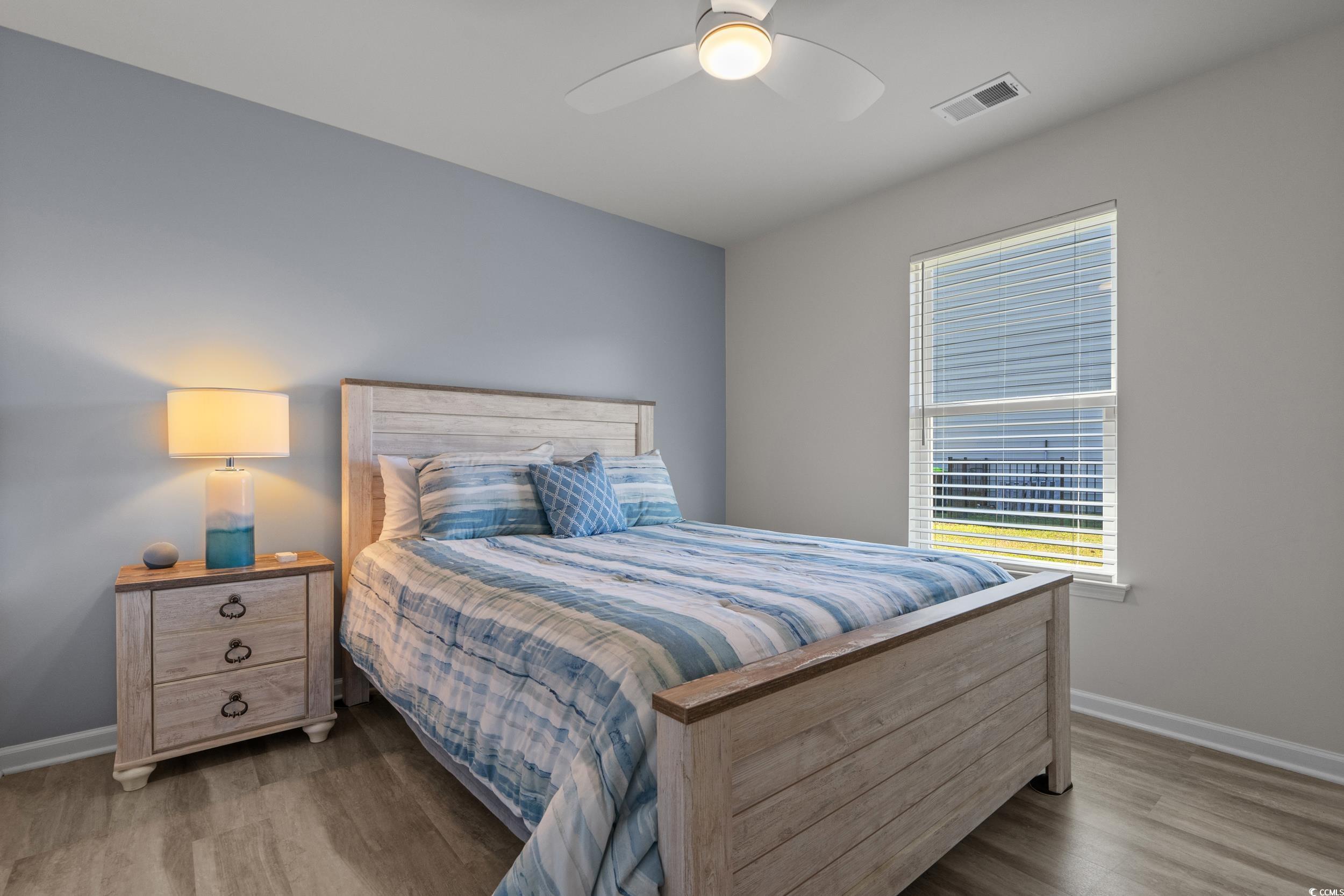 1803 Promise Pl. Myrtle Beach, SC 29588 - Photo 26 of 40 Bedroom featuring a ceiling fan and light wood finished floors