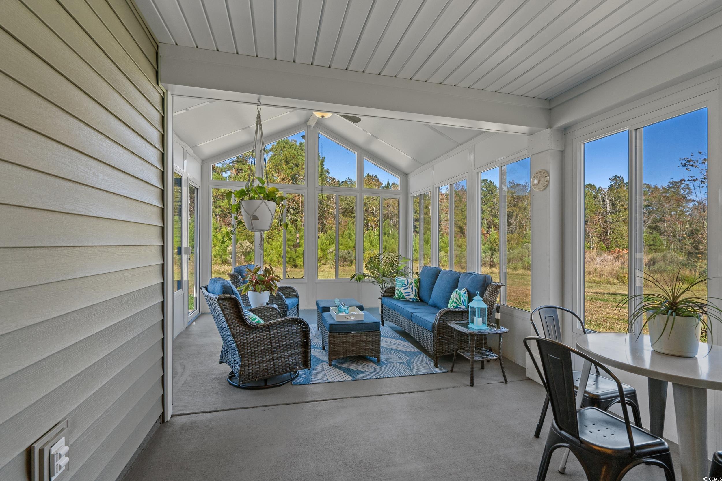1803 Promise Pl. Myrtle Beach, SC 29588 - Photo 31 of 40 Sunroom / solarium with lofted ceiling and an outdoor hangout area