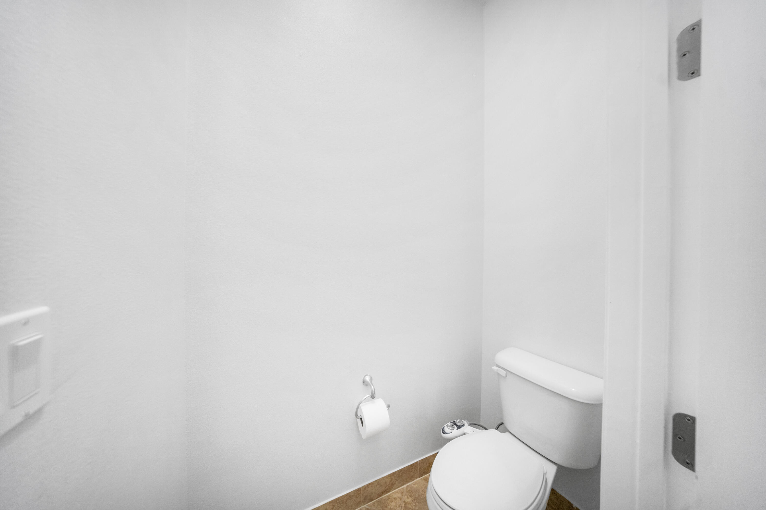 1430 Northwest 48th Lane Boca Raton, FL 33431 - Photo 21 of 54 a white toilet sitting next to a white wall