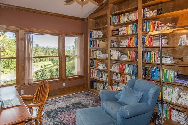 1075 Old Greenville Road Staunton, VA 24401 - Photo 27 of 50 a living room with furniture and a book shelf