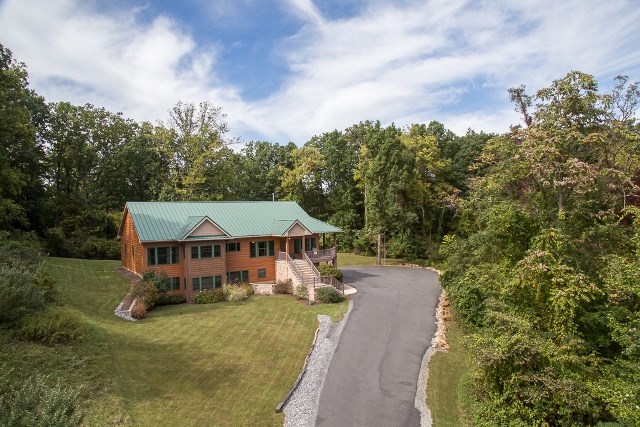 1075 Old Greenville Road Staunton, VA 24401 - Photo 3 of 50 an aerial view of a house with swimming pool and trees all around