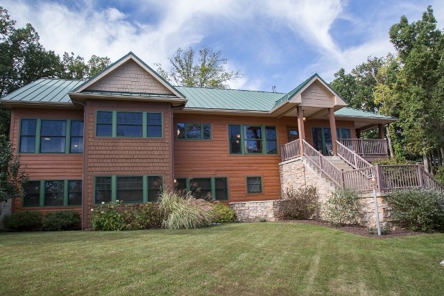 1075 Old Greenville Road Staunton, VA 24401 - Photo 5 of 50 a front view of a house with a garden