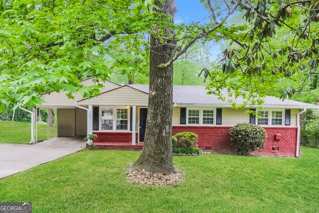 a front view of house with yard and green space