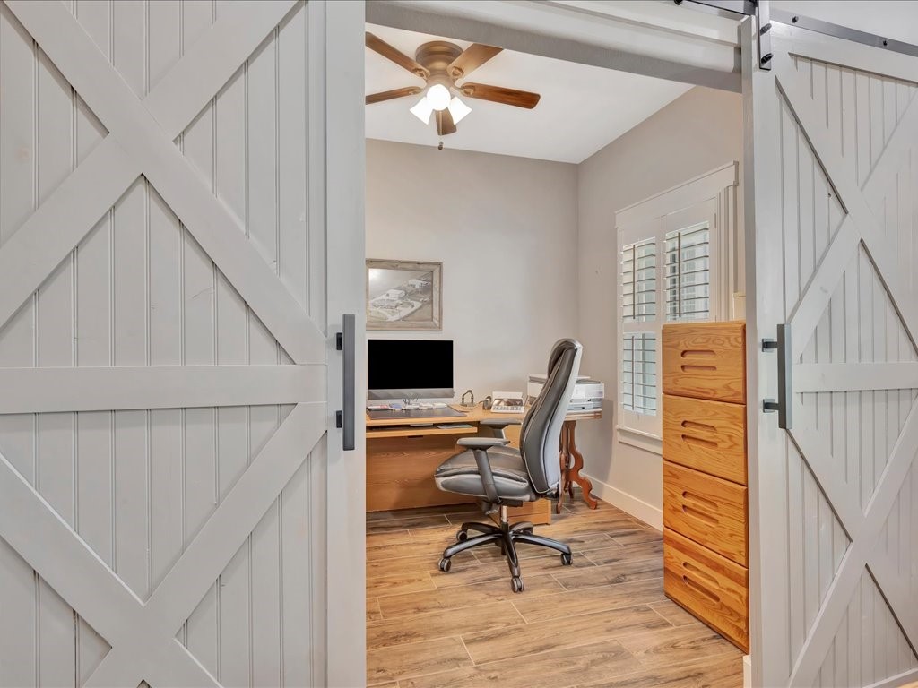 1105 C C Road Diboll, TX 75941 - Photo 11 of 40 a view of a workspace with furniture and a window