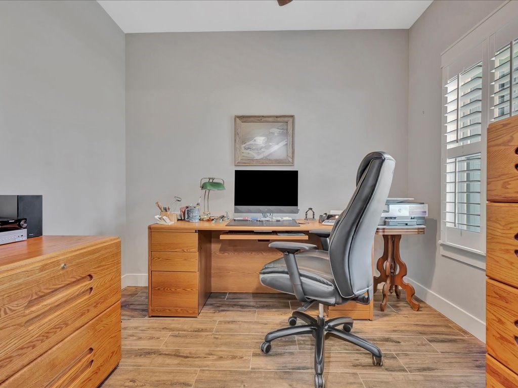 1105 C C Road Diboll, TX 75941 - Photo 12 of 40 a view of a workspace with furniture and a window