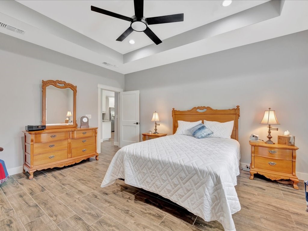 1105 C C Road Diboll, TX 75941 - Photo 24 of 40 a bedroom with a bed and a dresser