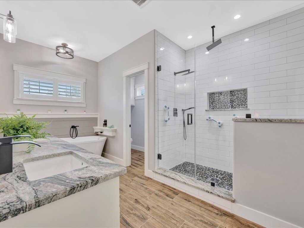 1105 C C Road Diboll, TX 75941 - Photo 25 of 40 a bathroom with a granite countertop sink mirror and shower