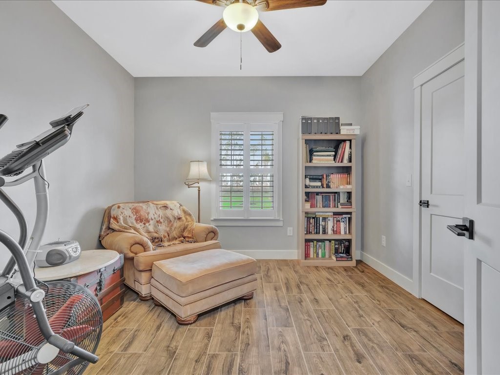 1105 C C Road Diboll, TX 75941 - Photo 30 of 40 a living room with furniture and a book shelf