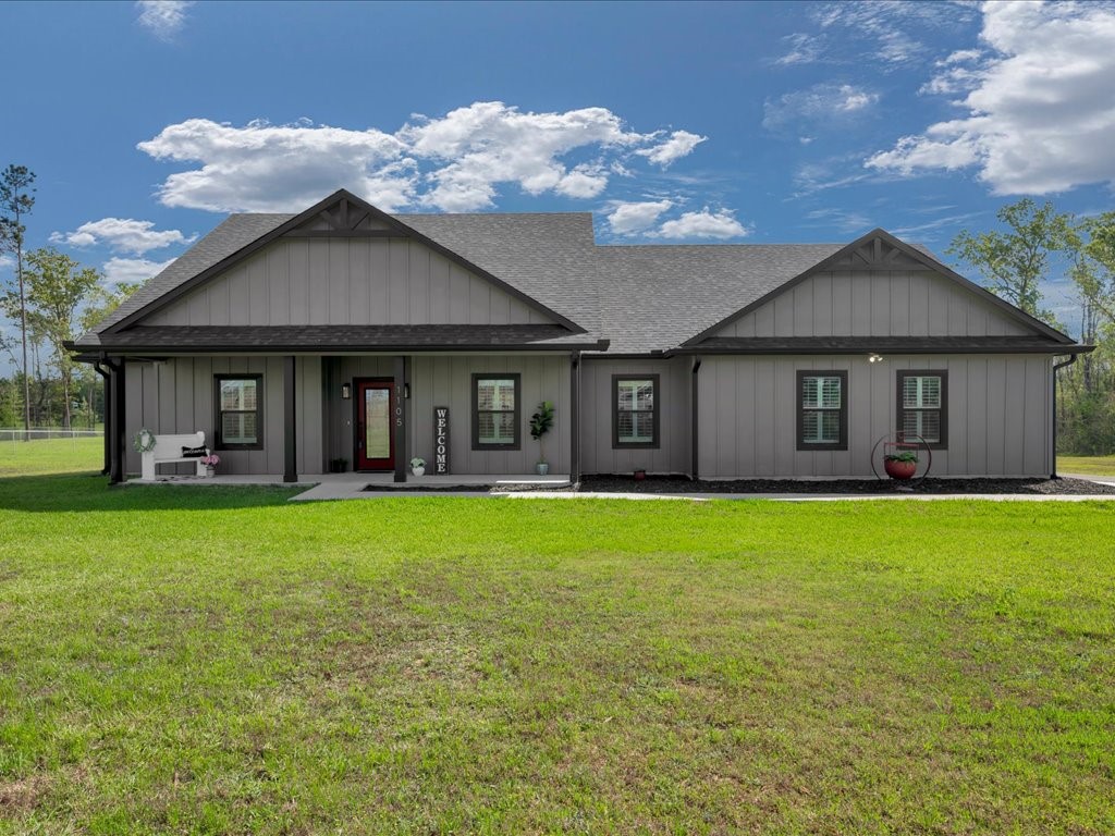 1105 C C Road Diboll, TX 75941 - Photo 3 of 40 a view of a house with a yard