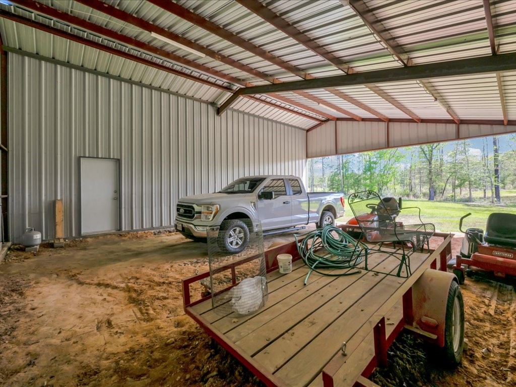 1105 C C Road Diboll, TX 75941 - Photo 37 of 40 a view of a backyard with sitting area
