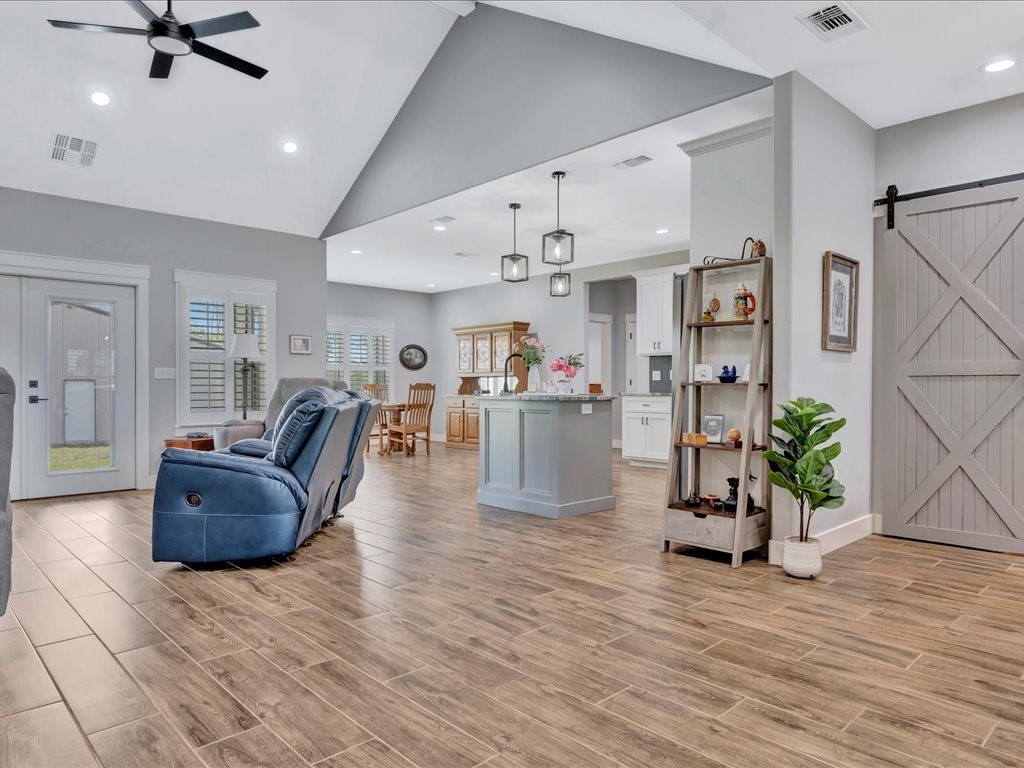 1105 C C Road Diboll, TX 75941 - Photo 9 of 40 a living room with furniture and kitchen view