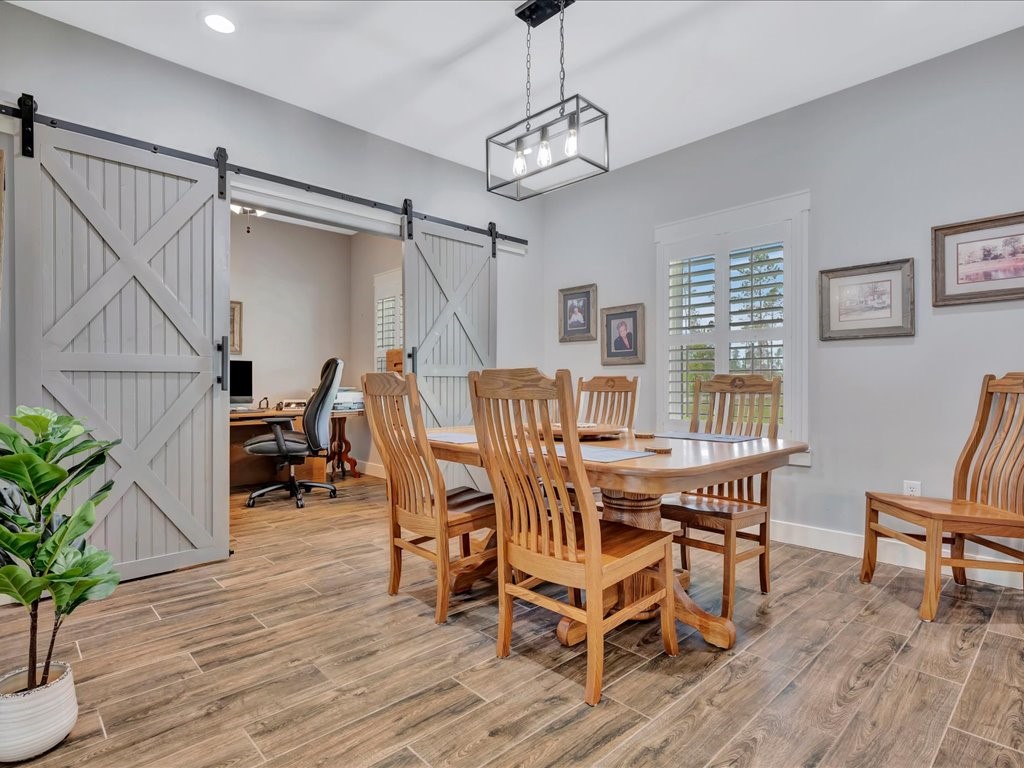 1105 C C Road Diboll, TX 75941 - Photo 10 of 40 a view of a dining room with furniture window and wooden floor
