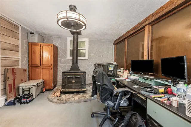 a bedroom with furniture and a window