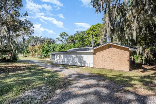 a view of a back yard of the house