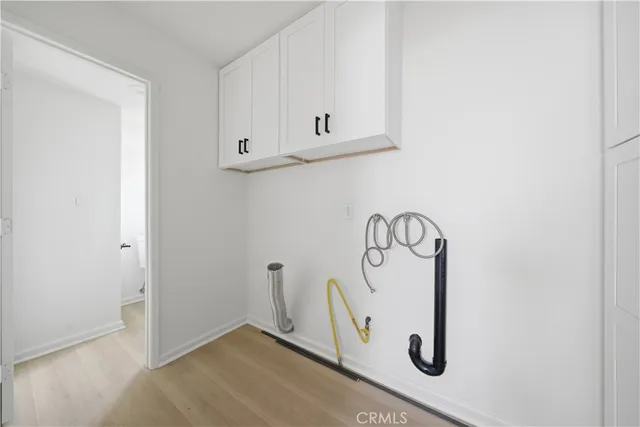 a view of a livingroom with white cabinets