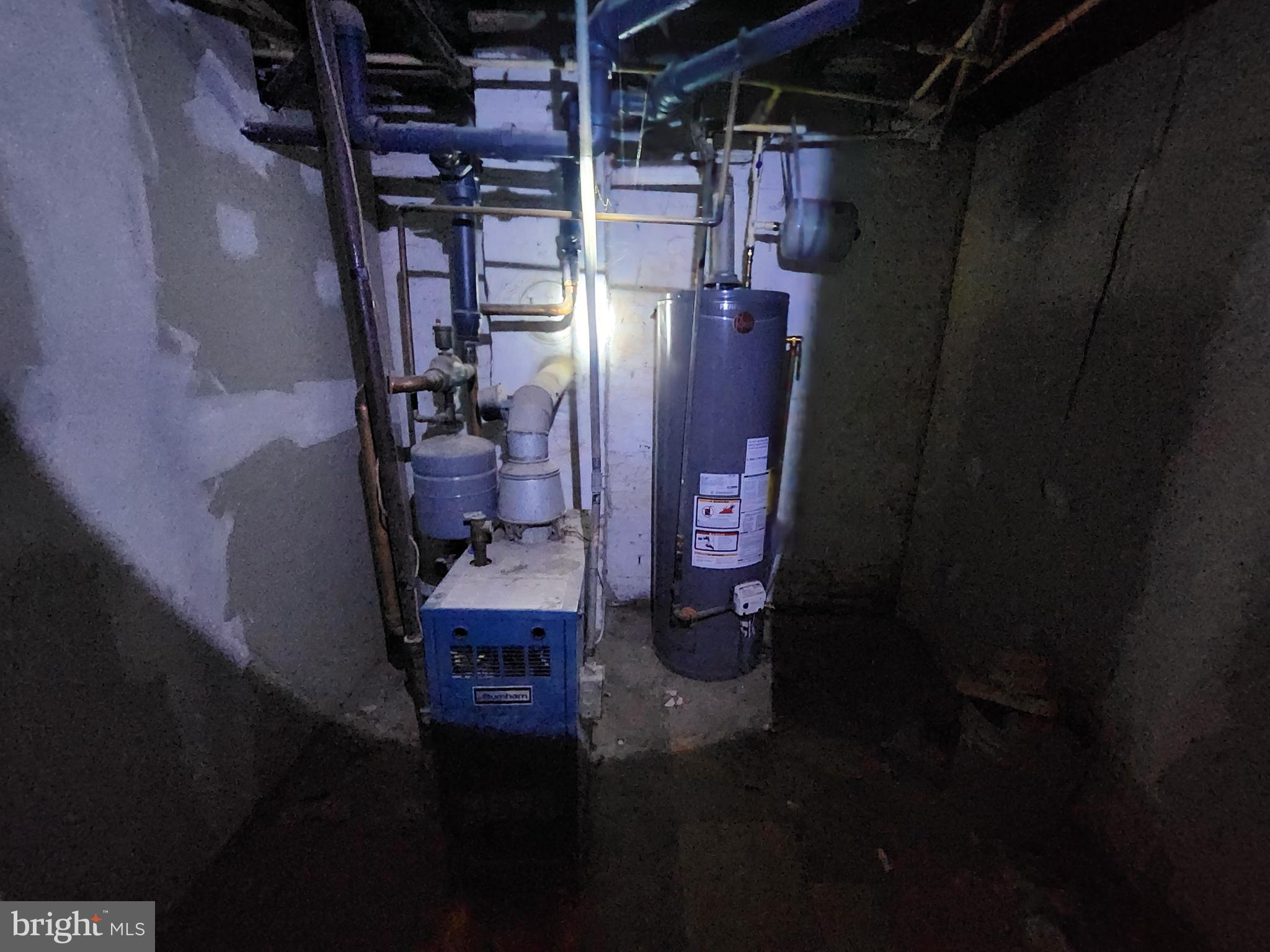 810 Appleton Street Baltimore, MD 21217 - Photo 14 of 27 a bathroom with a toilet and a shower