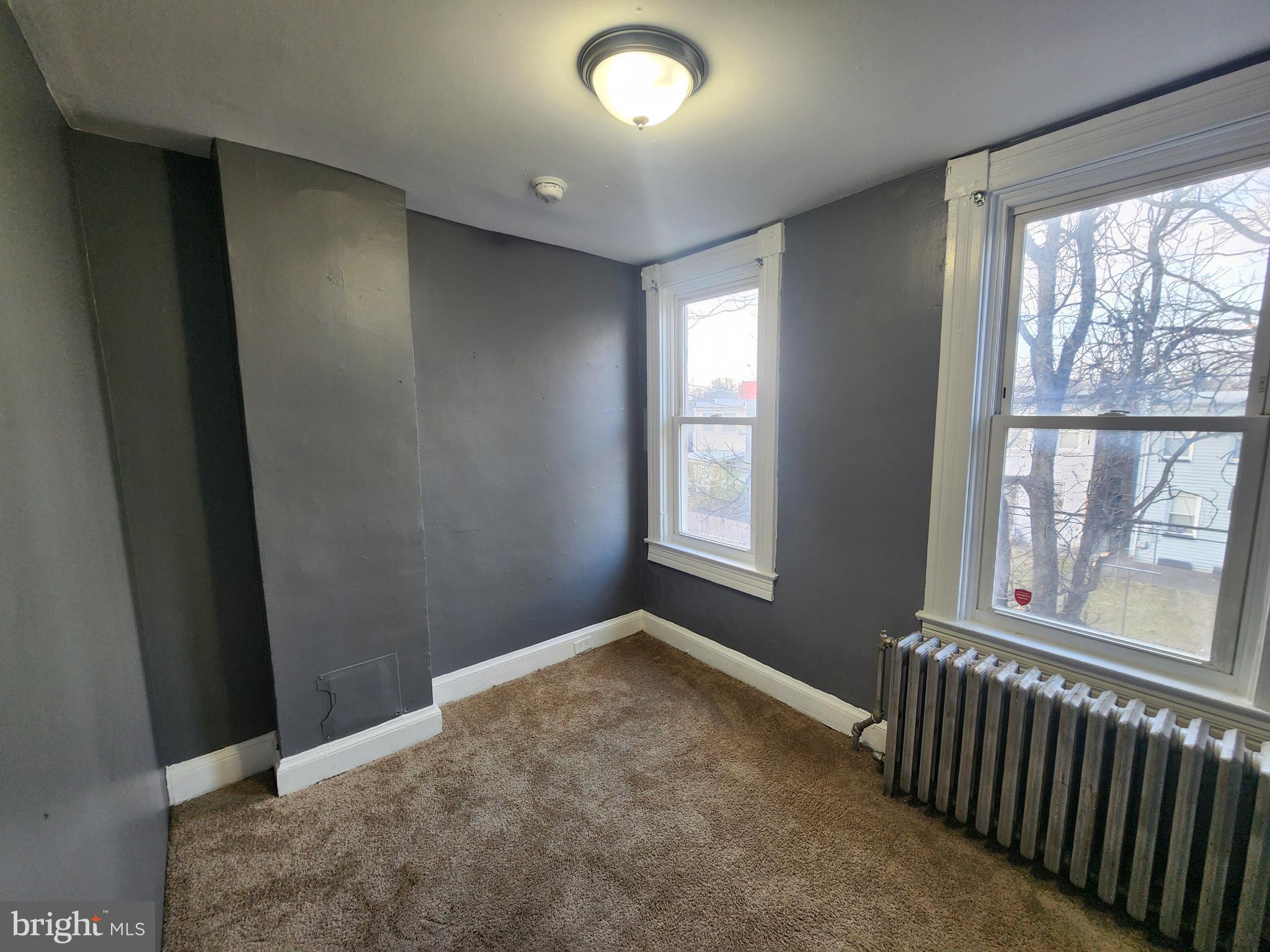 810 Appleton Street Baltimore, MD 21217 - Photo 21 of 27 an empty room with windows