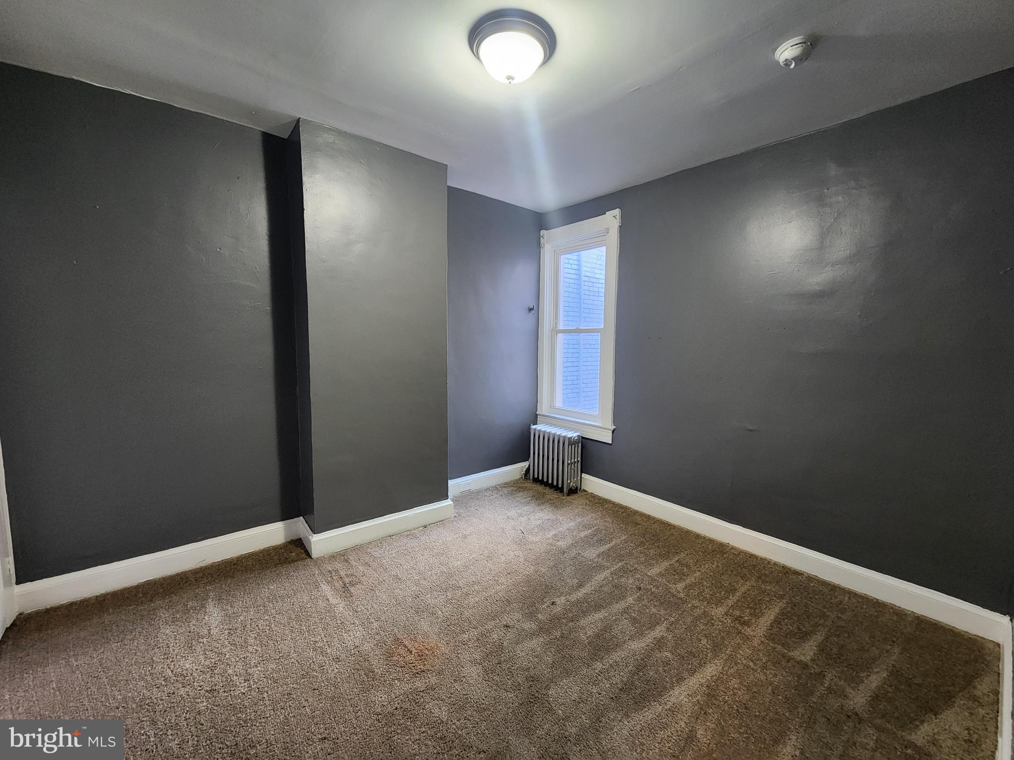 810 Appleton Street Baltimore, MD 21217 - Photo 24 of 27 an empty room with windows