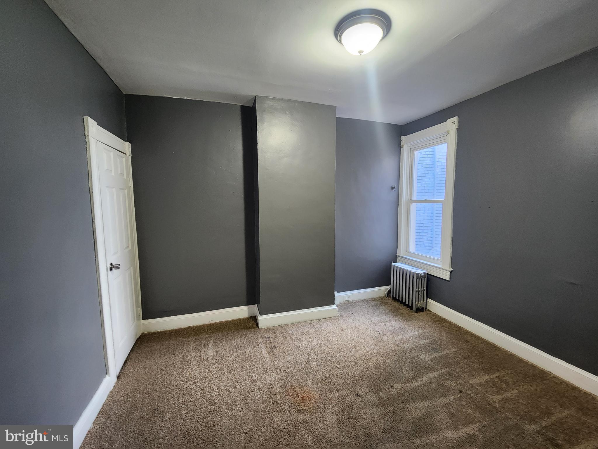 810 Appleton Street Baltimore, MD 21217 - Photo 25 of 27 an empty room with windows
