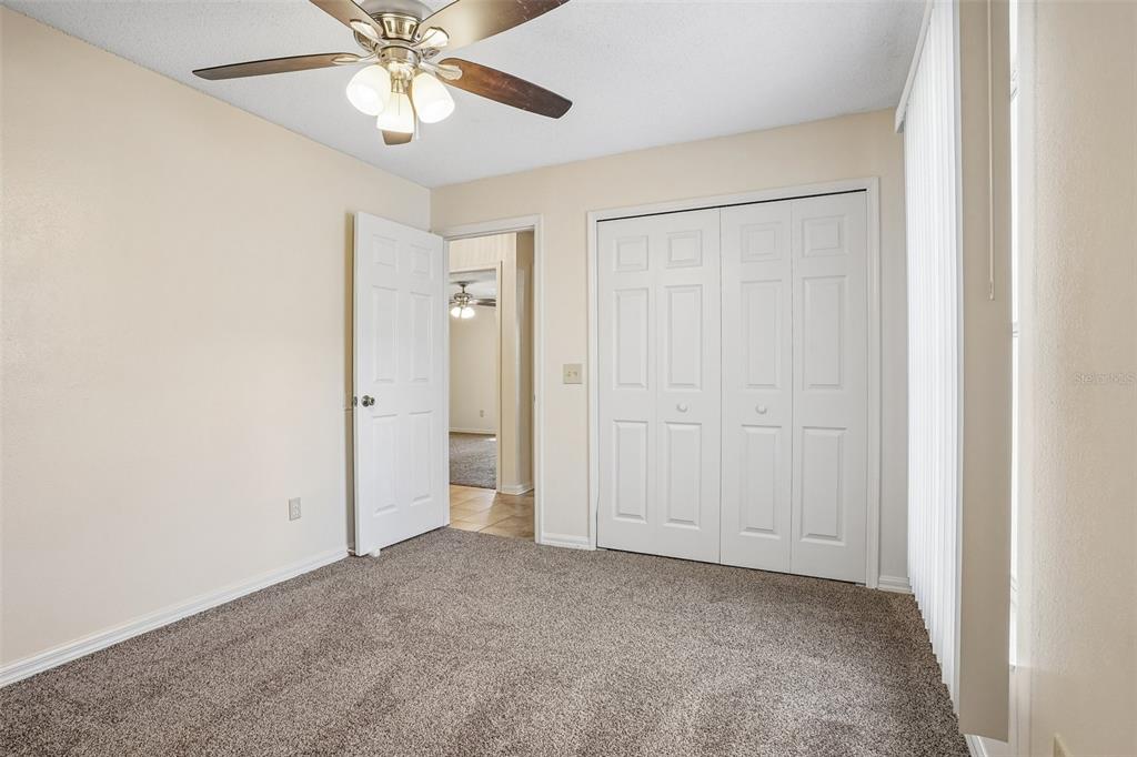 2596 Alclobe Circle Ocoee, FL 34761 - Photo 51 of 70 a view of an empty room and chandelier fan