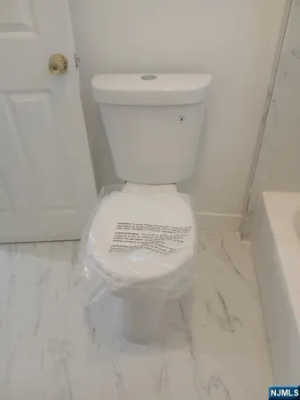 a close view of a toilet in a bathroom