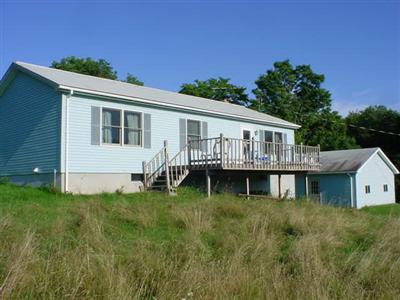 106 Bob Holbrook Road Otego, NY 13825 - Photo 1 of 1 Front with garage, the home has a Westerly view