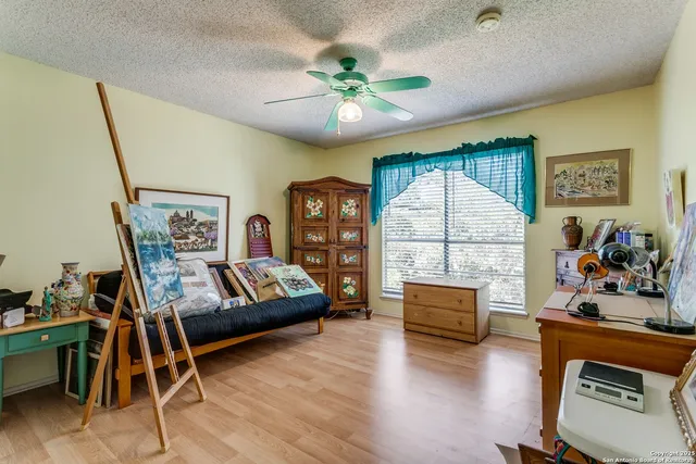 a bedroom with furniture and a window