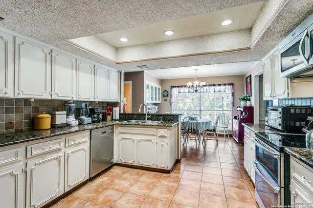 a kitchen with lots of counter top space and appliances
