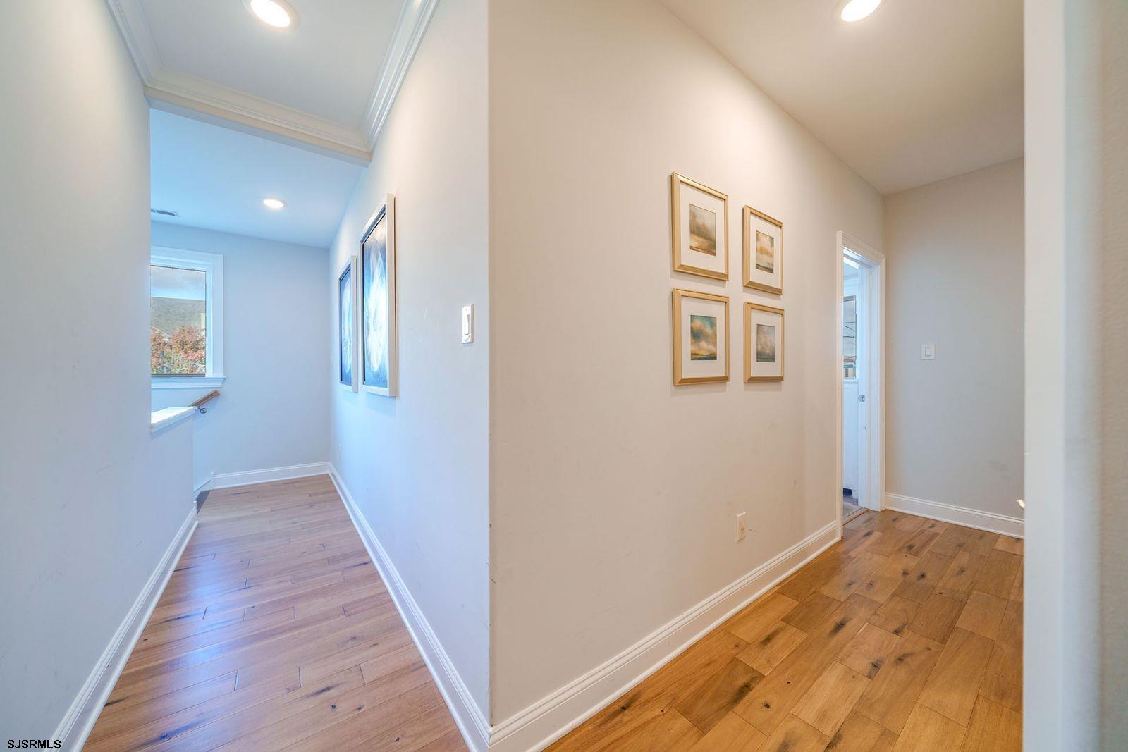 901 Wesley Avenue, Unit B Ocean City, NJ 08226 - Photo 12 of 33 wooden floor in an empty room with a window