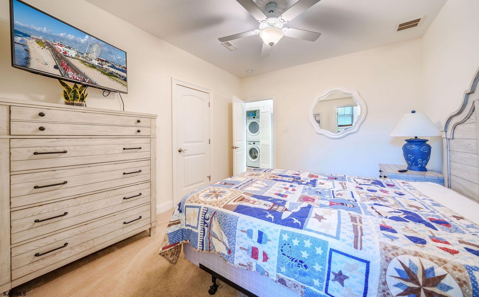 901 Wesley Avenue, Unit B Ocean City, NJ 08226 - Photo 16 of 33 a bedroom with a bed and a cabinet