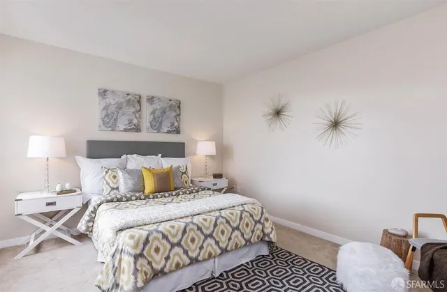 a bedroom with a bed and a lamp